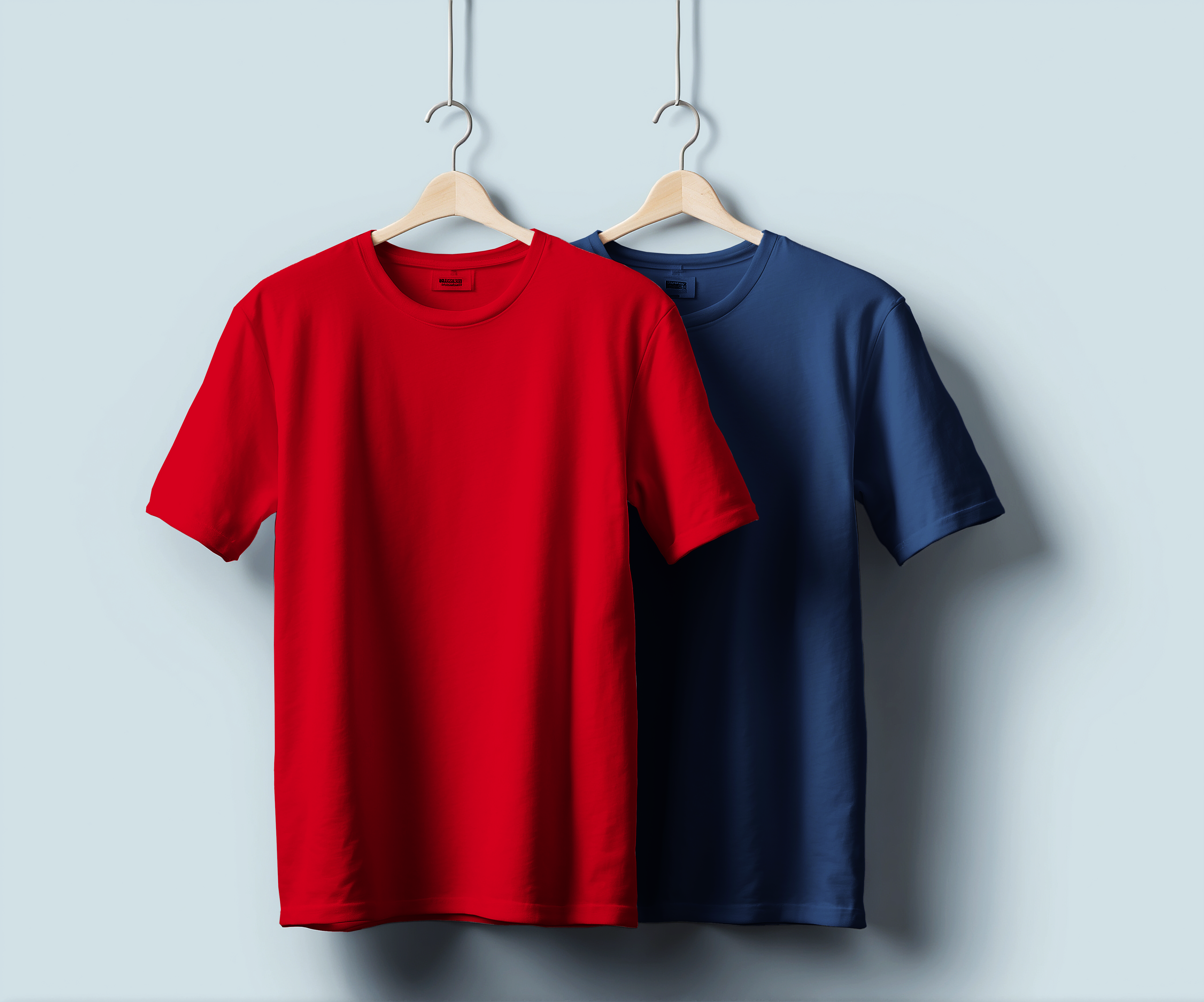 a bright red & blue t-shirt, exuding a casual and approachable demeanor.