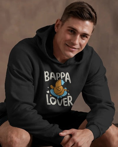 A man in a black hoodie displaying the text "bappa lover" prominently on the front.