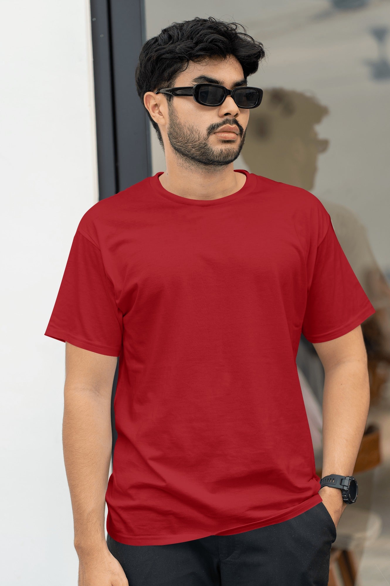 A man dressed in an red t-shirt