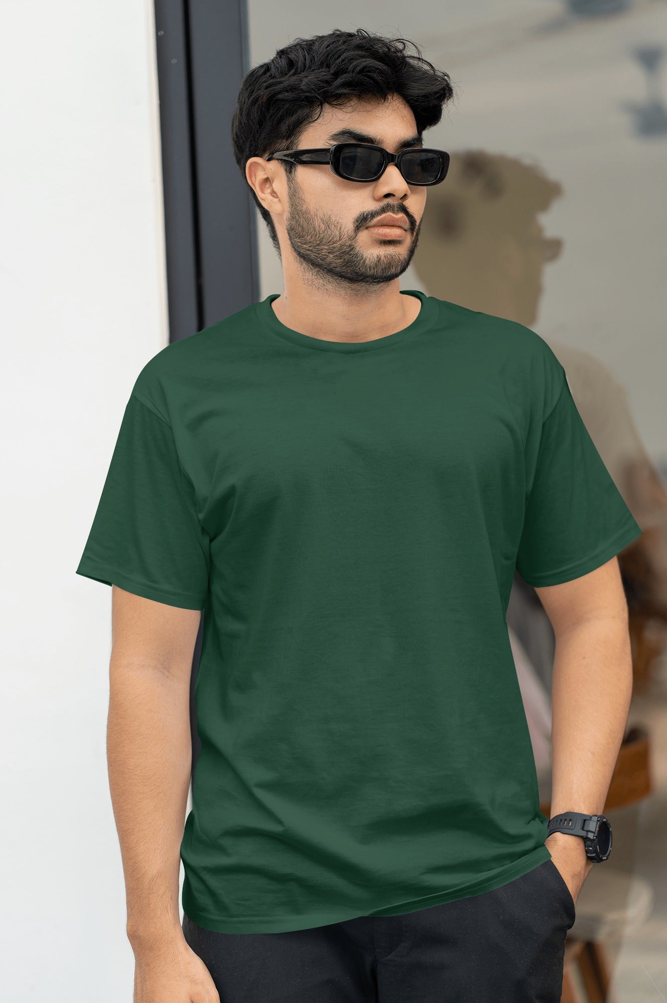 A man wearing a bright Green t-shirt