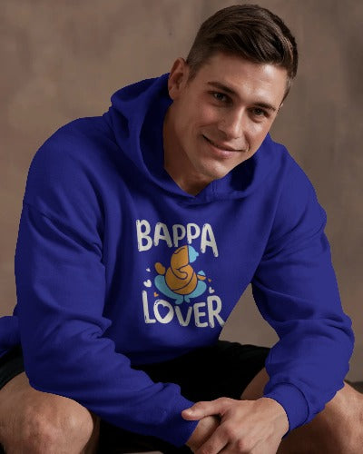 A man dressed in a navy blue hoodie featuring the phrase "bappa lover," reflecting a trendy look. 