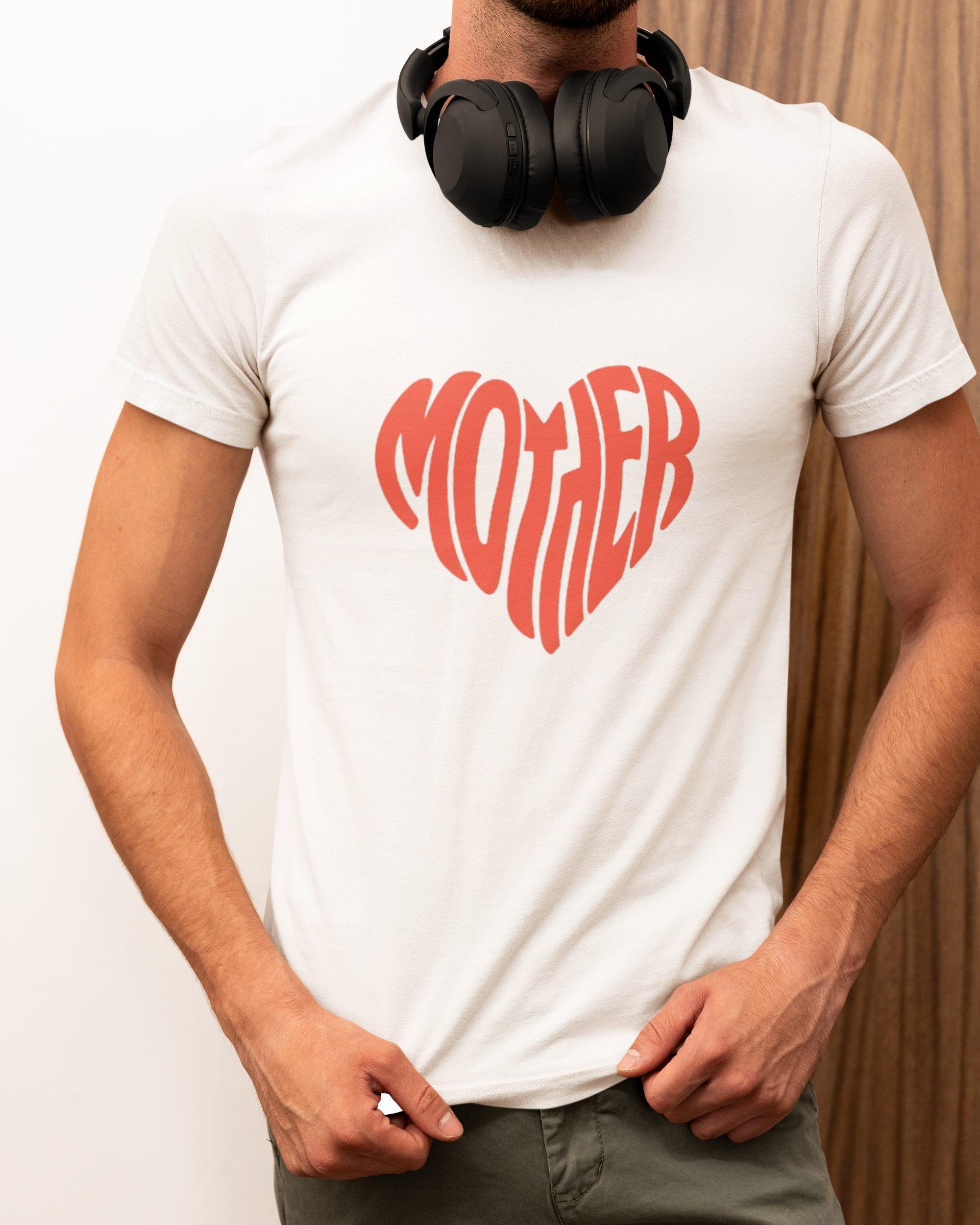 A man in a white t-shirt featuring a red heart design.