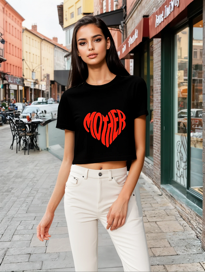  woman wearing a black crop top adorned with a red heart, showcasing a casual and stylish look.