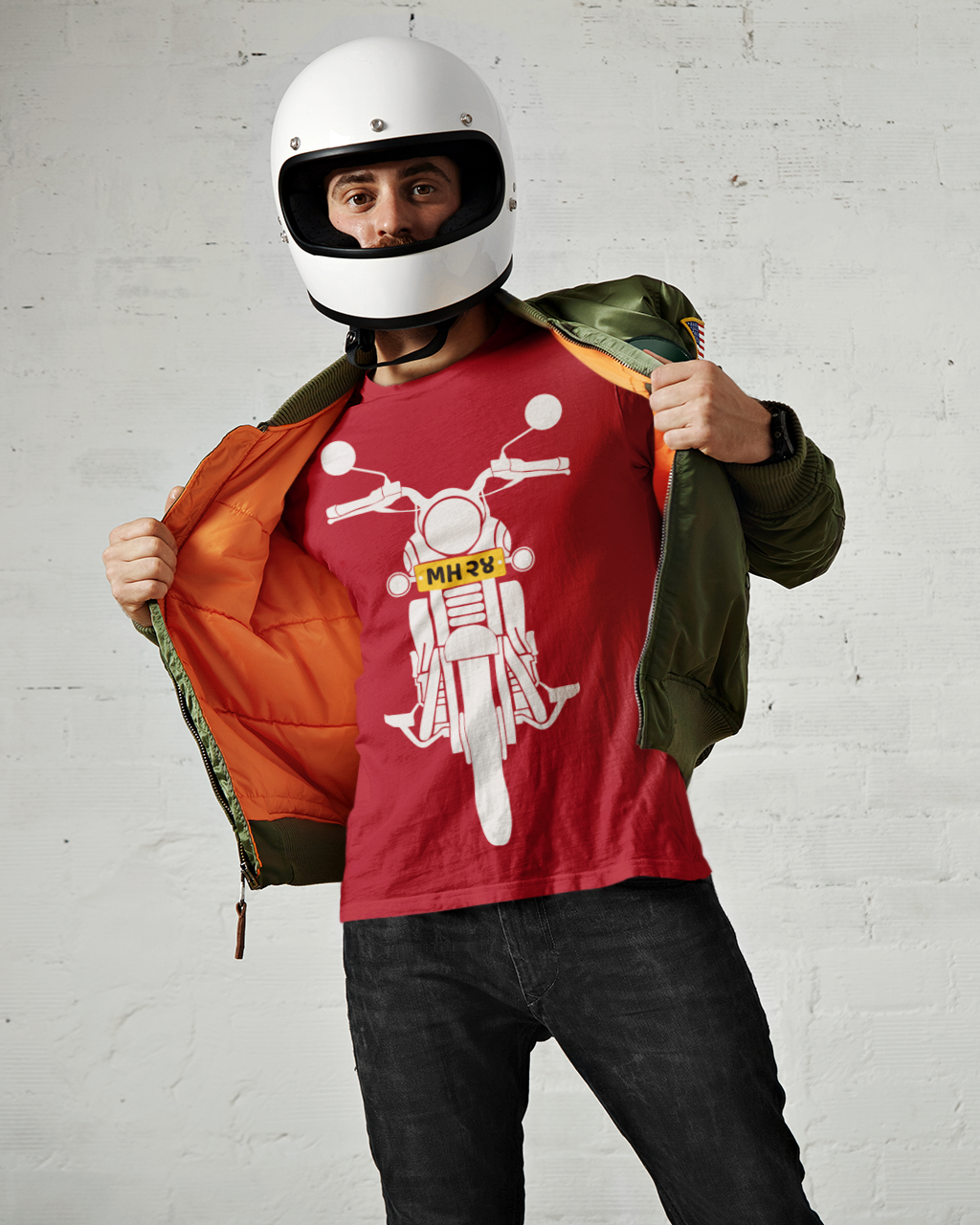 A red t-shirt featuring a motorcycle graphic stands confidently, showcasing his casual style